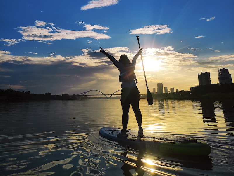 Faces of WildChina: Juanita Huang 黄千千 Juanita paddleboarding on the water in Nanning, Guangxi.