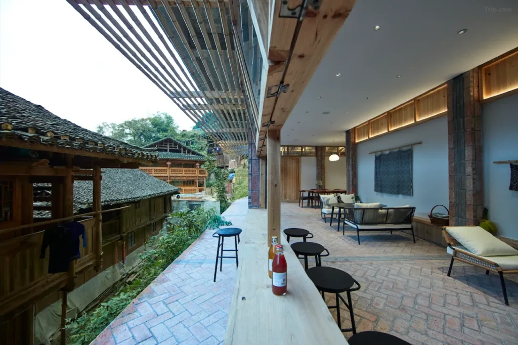 WildChina introduces the Best Boutique Hotels in China (2024) - Interior of the Well House, featuring blackened brick floors and cedarwood walls.