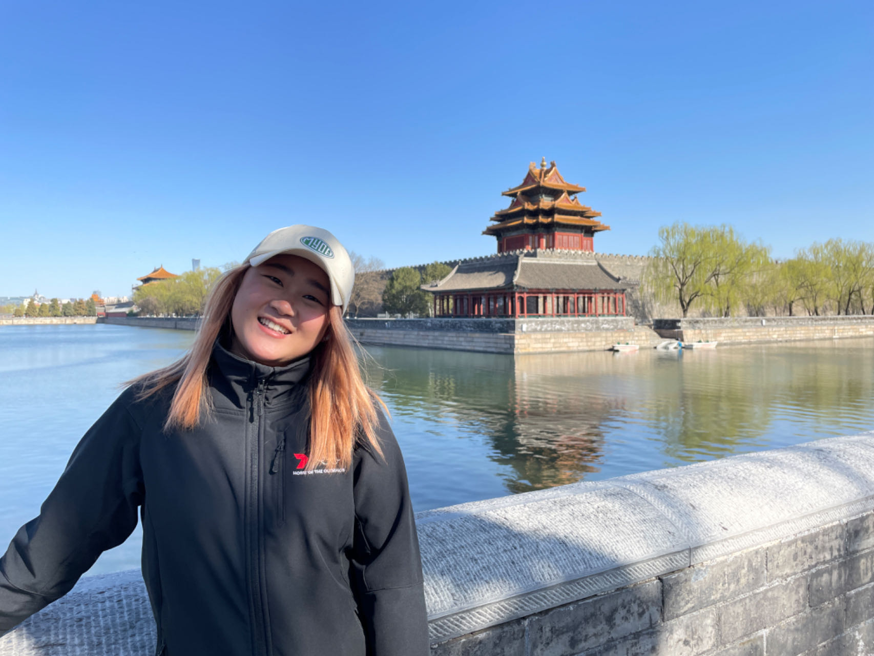 Faces of WildChina: Fang Fang 方钰霞 Fang Fang smiling at the Forbidden City, Beijing.