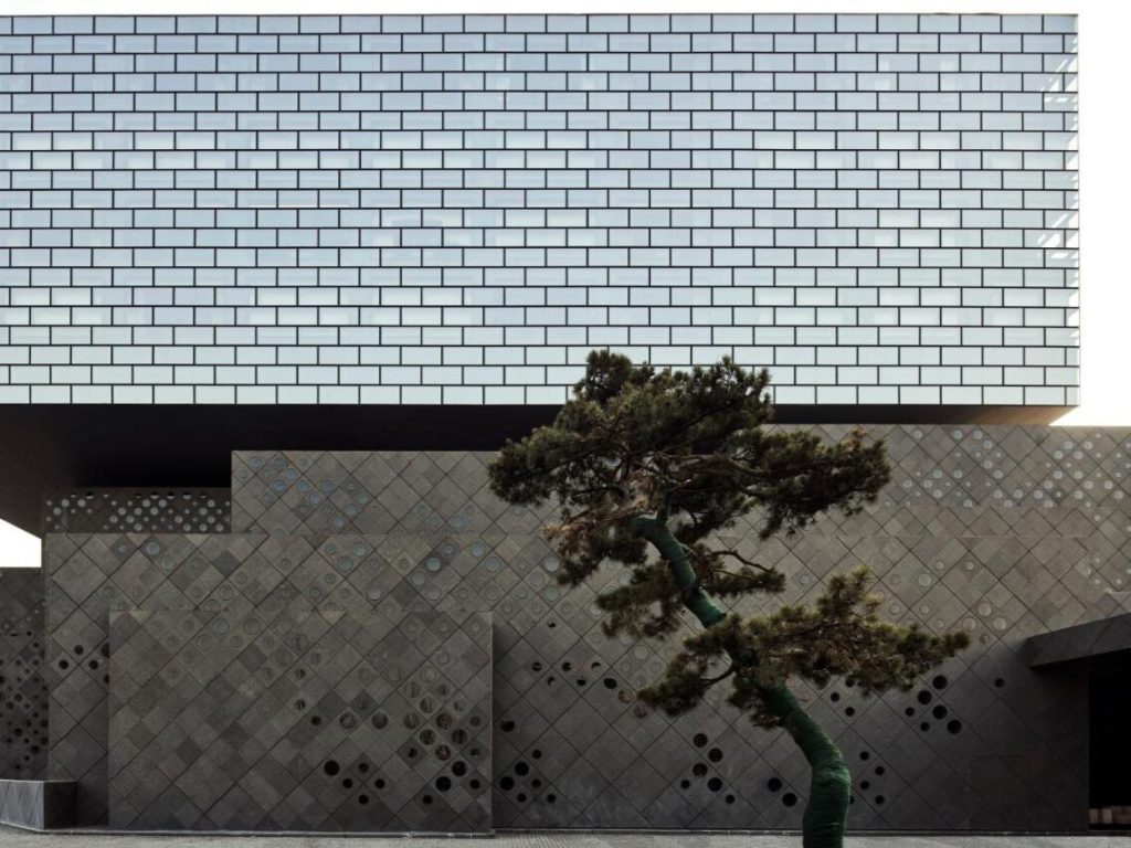 The angular exterior of The PuXuan Hotel and Spa, showcasing a distinctive design by Ole Scheeren